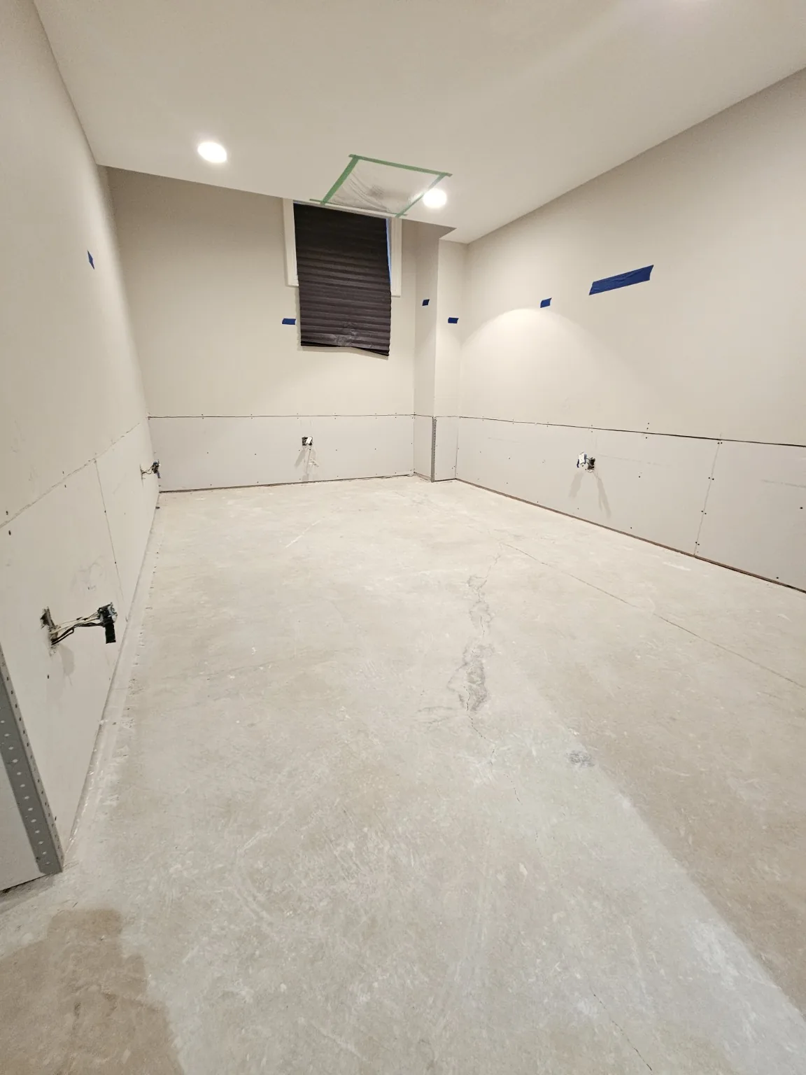Noblesville, IN basement room mid-restoration with new drywall replacing the flood-cut lower wall