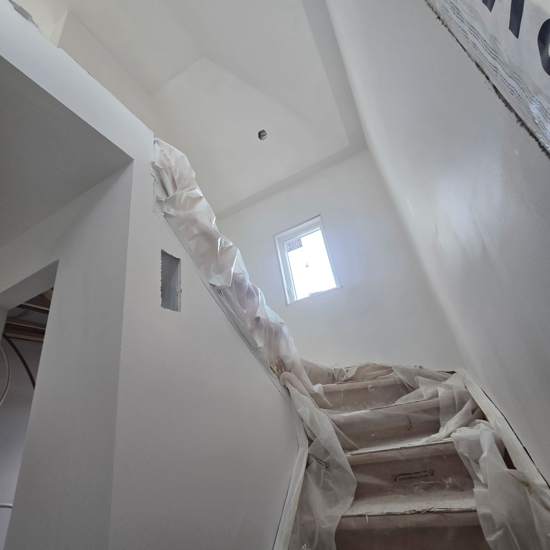 Drywall installation during a home renovation in Noblesville, IN