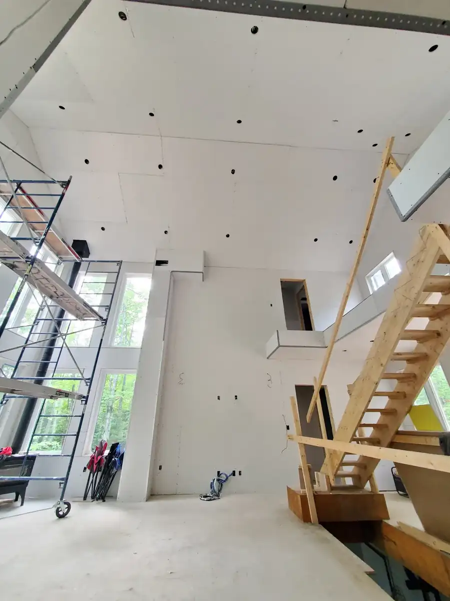 Stairwell in a Westfield new-construction home with drywall hung and finished