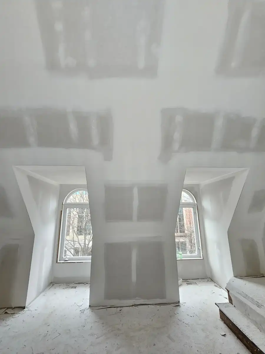 Drywall finished around dormer windows in an older Cicero home