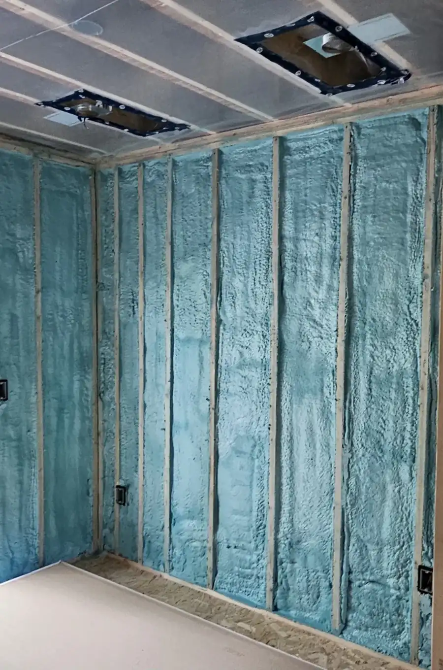 Closed cell spray foam insulation applied between wall studs in a new Noblesville, IN build