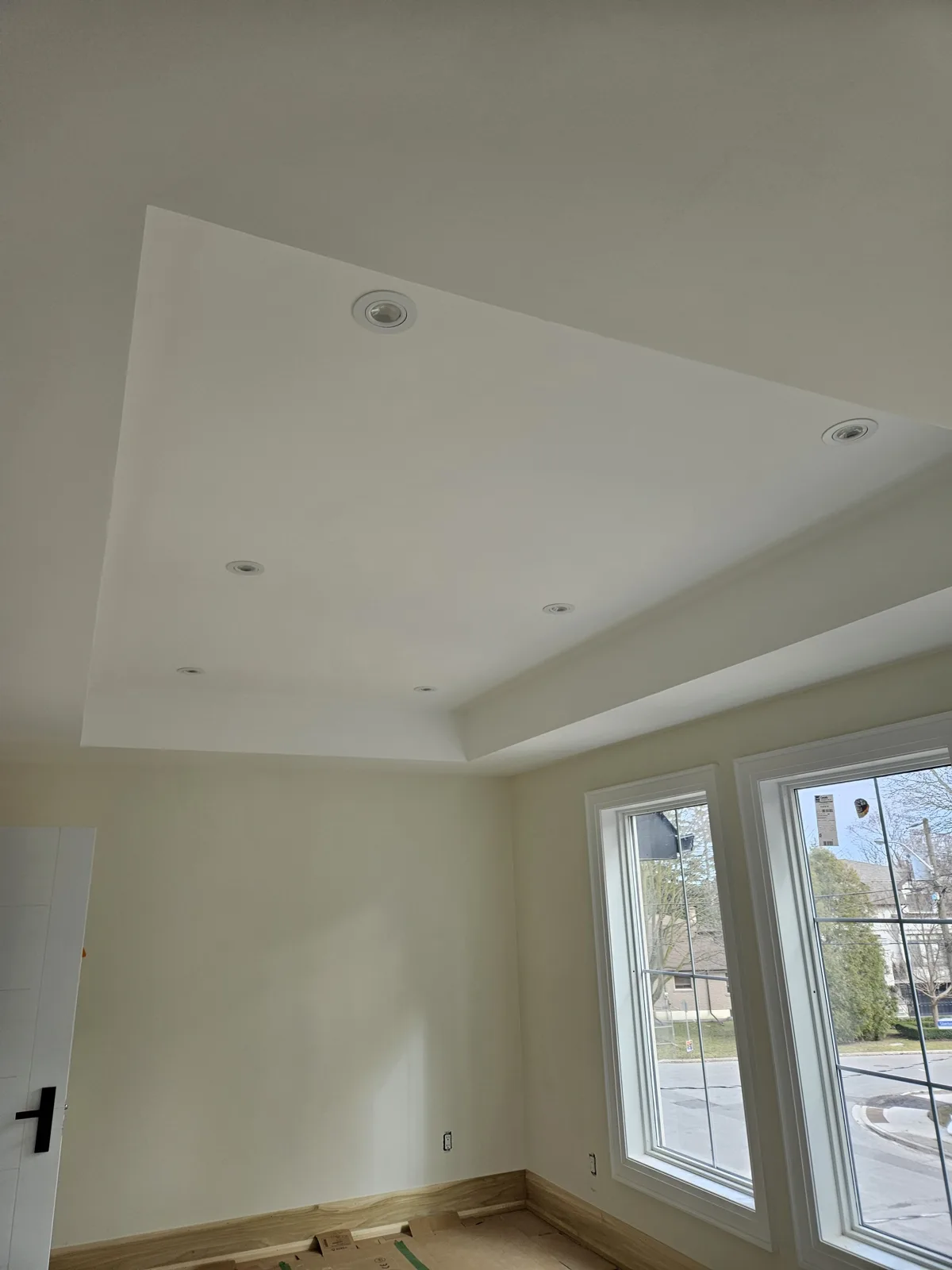 Detail of a finished drywall tray ceiling with crisp corners in a Noblesville, IN home